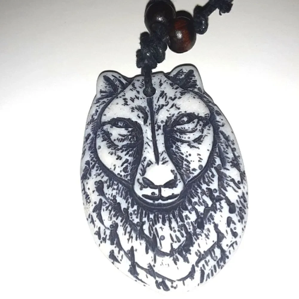 Hand CRAFTED UNISEX wolf charm with adjustable necklace